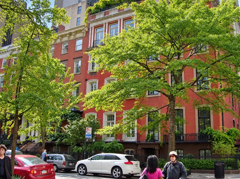 The western row of Gramercy Park houses behind green trees in 2010, with No. 1 at the right.