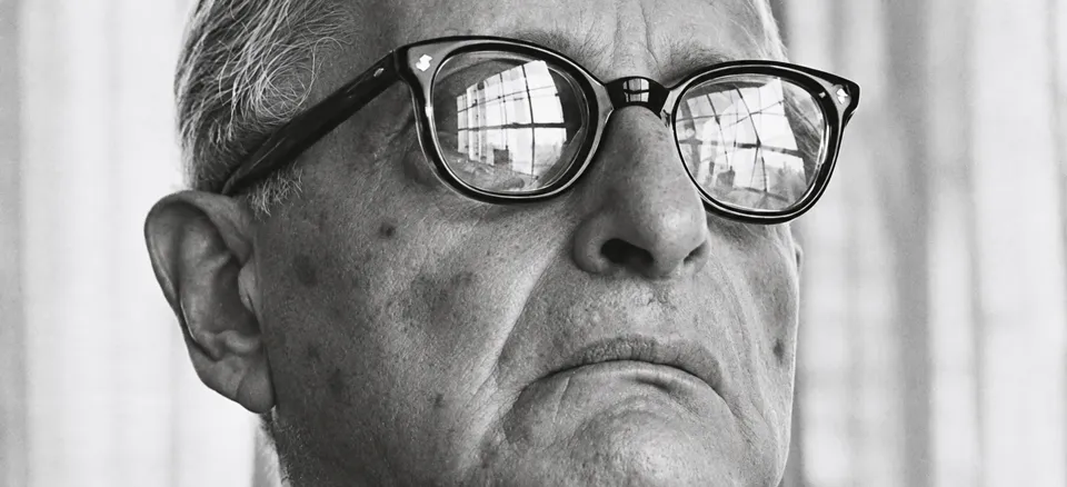 Archival black-and-white portrait of Max Ascoli wearing glasses.