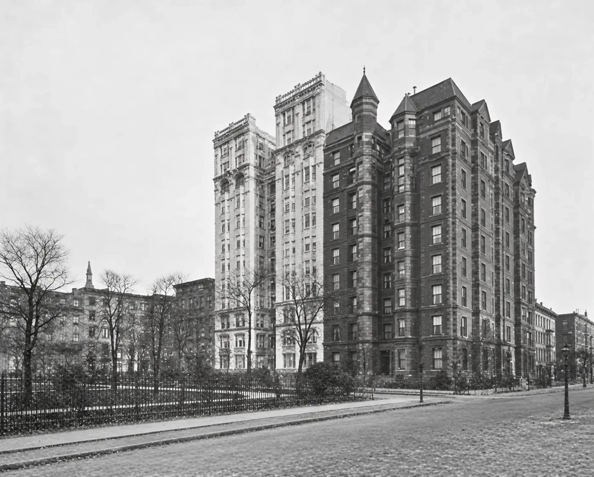 The pale Gothic façade of No. 36 beside the older brick towers of No. 34, photographed in 1911.