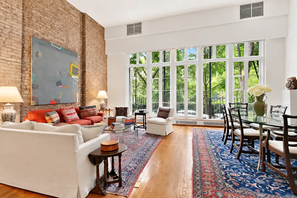 A park-facing apartment at 48 Gramercy Park North with tall windows and a mezzanine.