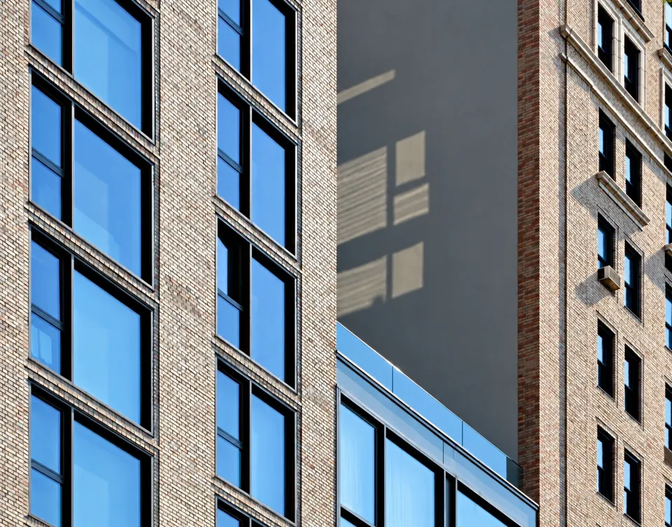 The remodeled annex, left, meets new glazing and the older hotel, right.