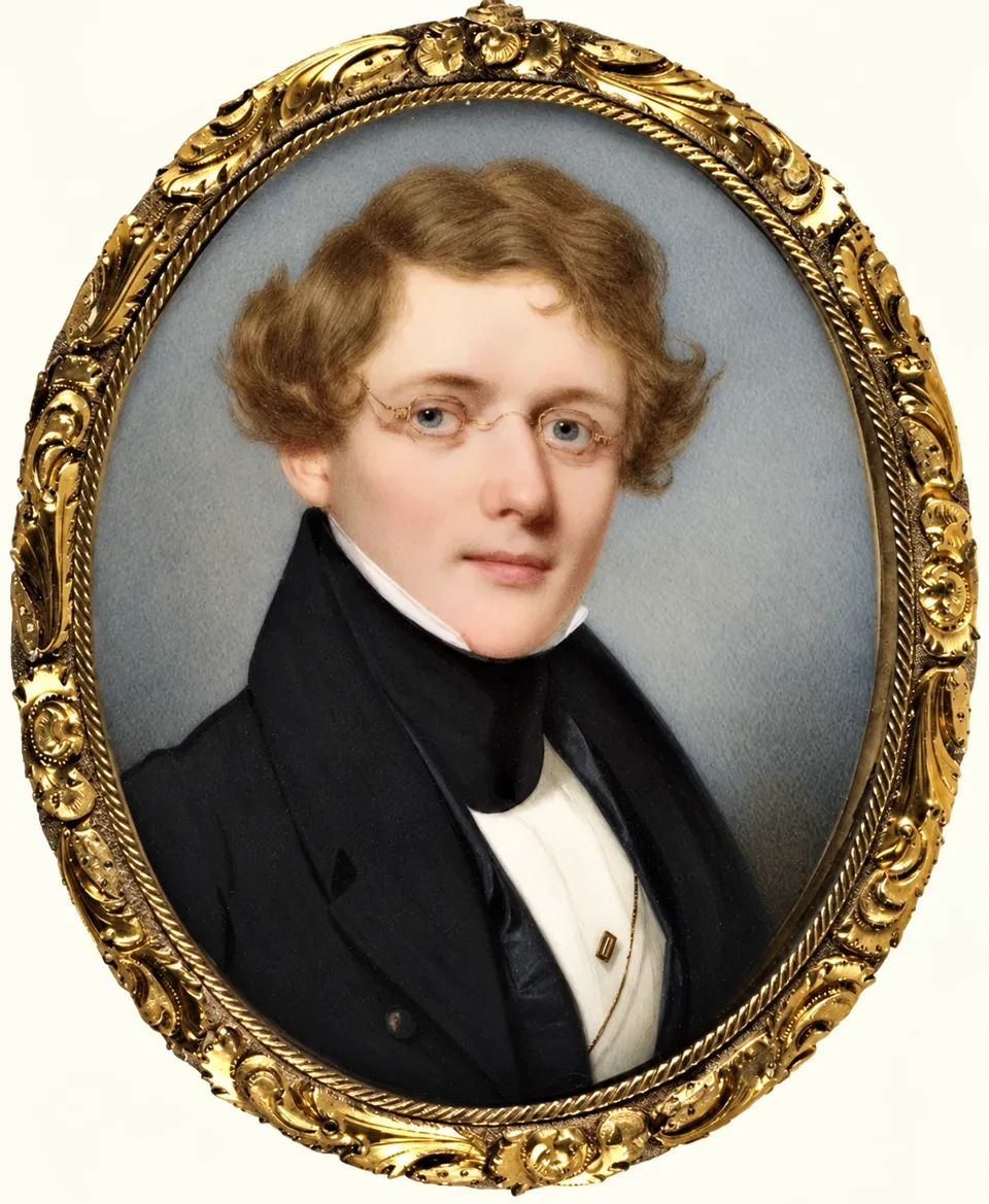 Miniature portrait of Gouverneur Morris II, wearing spectacles and a dark coat, in an oval gold frame.