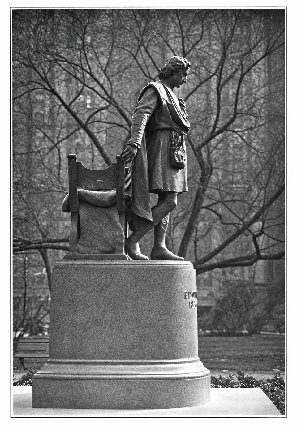 A period photograph of the completed Booth memorial, showing the bronze figure, chair and granite pedestal.