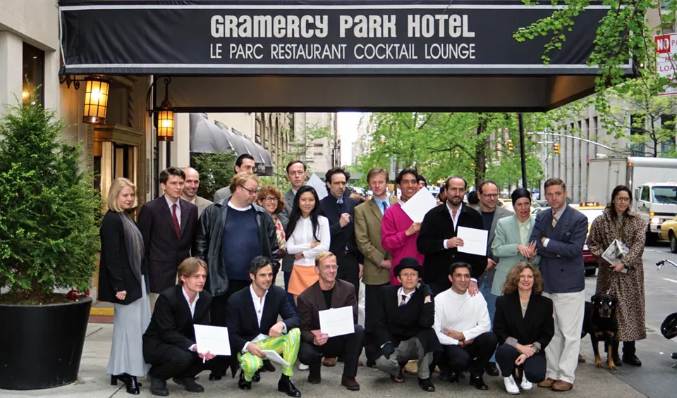 A group of art dealers posing beneath the Gramercy Park Hotel entrance canopy in 1996.