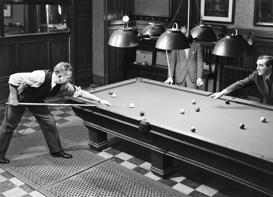 Three men around a billiards table beneath hanging lamps in The Players.