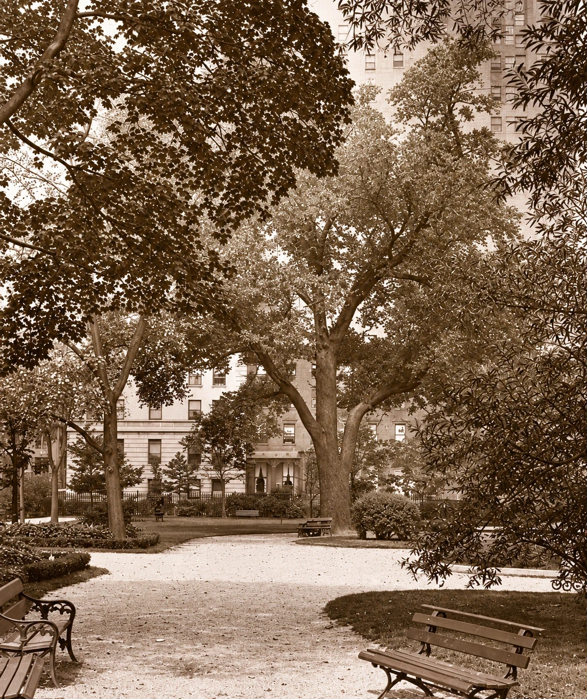 A sepia lantern-slide view of curving paths, benches, and mature trees in Gramercy Park.
