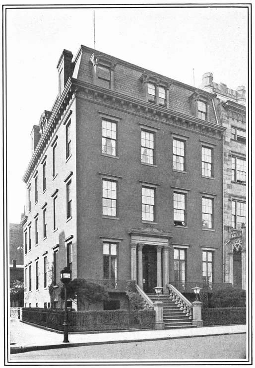 The former Luther C. Clark mansion, with its high stoop, mansard roof and long Irving Place side.