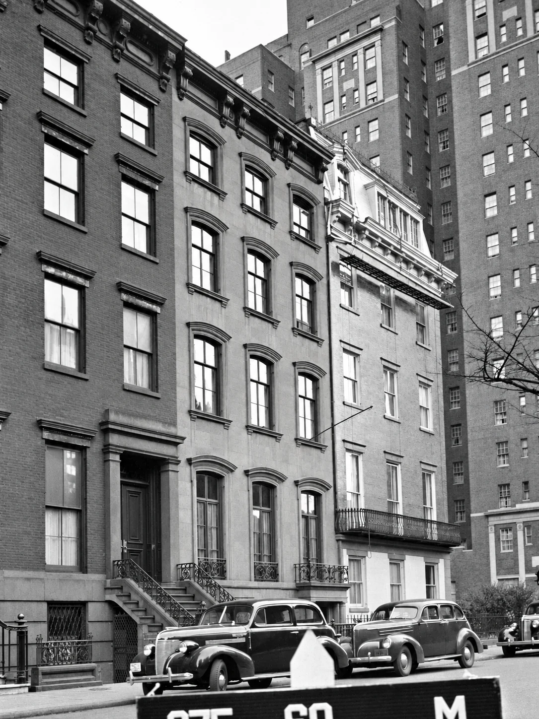 No. 21 at center in the municipal tax photograph, c. 1940, before the brownstone façade was replaced.