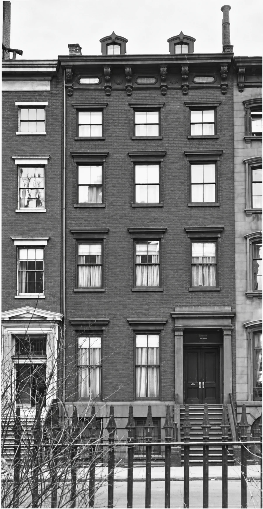The house about 1900, with two dormers above the cornice.