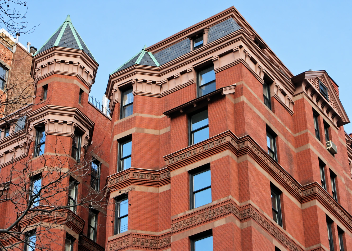 The red-brick upper floors, turret and slate roofline of The Gramercy in 2013