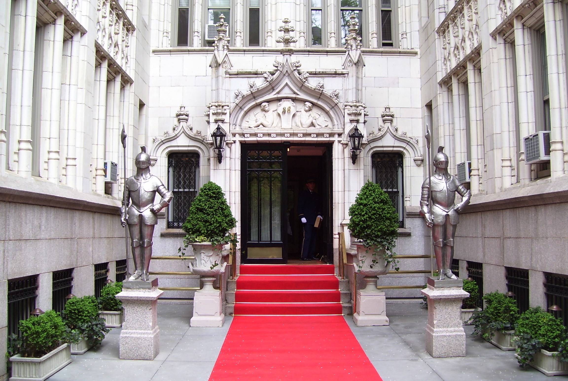 Two armored knights flank the entrance court and red-carpeted steps of 36 Gramercy Park East.