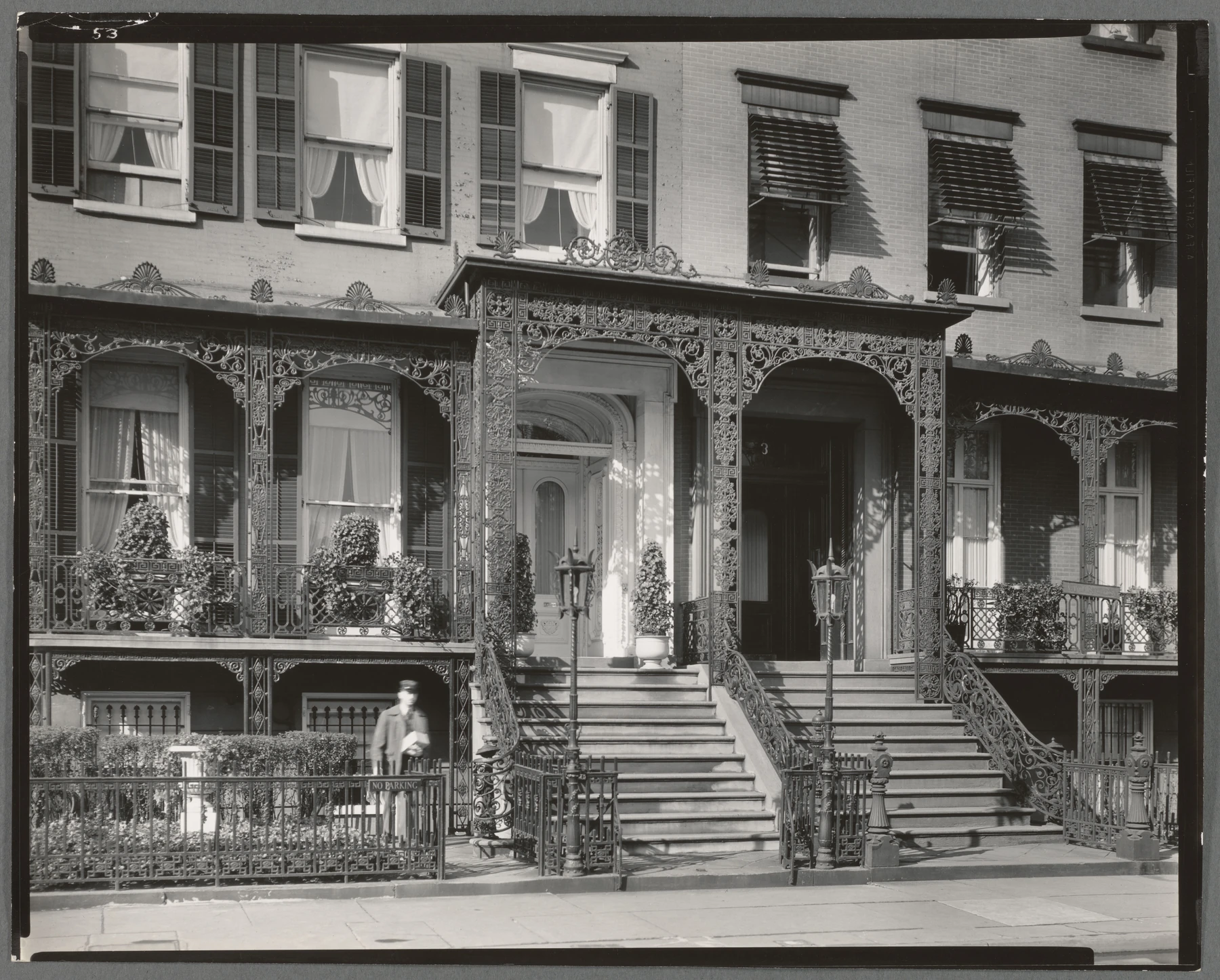 The paired porches and neighboring houses on Gramercy Park West in a black-and-white photograph from 1935.
