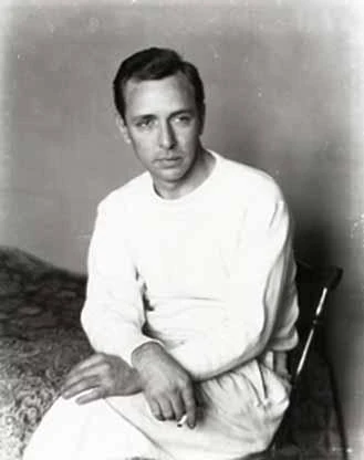 A seated Ralston Crawford in a white sweater, photographed in 1938.