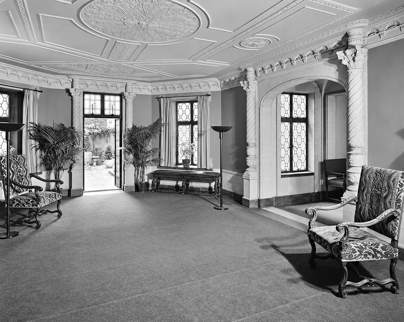 The circular lobby in May 1941, with upholstered chairs, leaded-glass windows and an ornamental ceiling.
