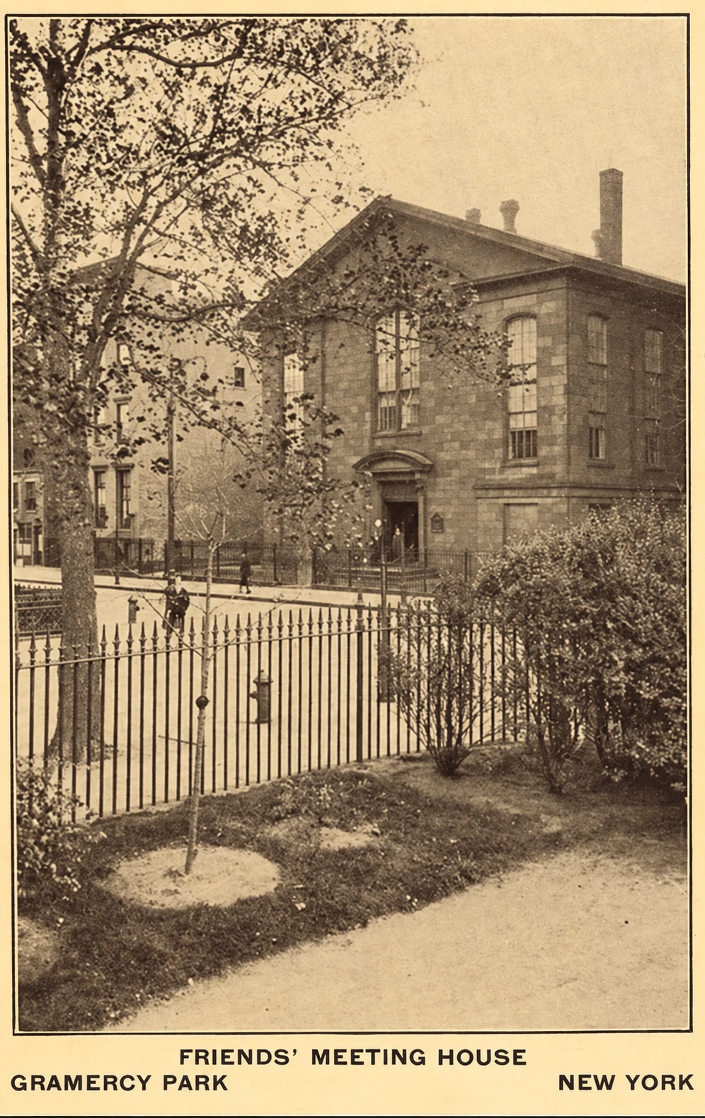 Sepia postcard of the Friends Meeting House seen through Gramercy Park’s trees and iron fence.