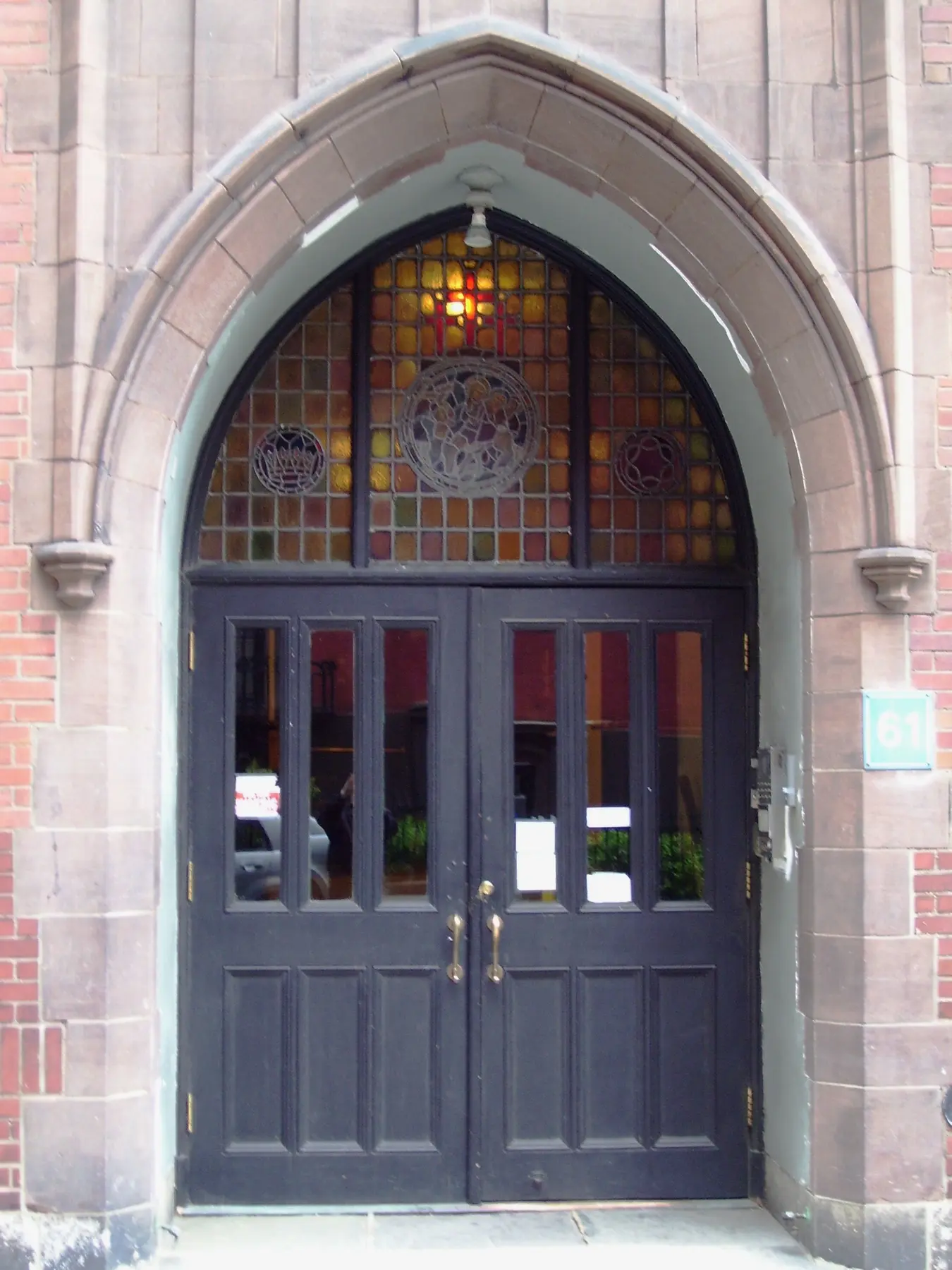 The carved pointed arch and iron gates at the entrance to Calvary House.