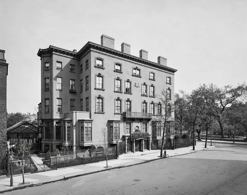 Henry Poor’s residence at One Lexington Avenue, with its balcony, entrance, iron fence and adjoining conservatory.