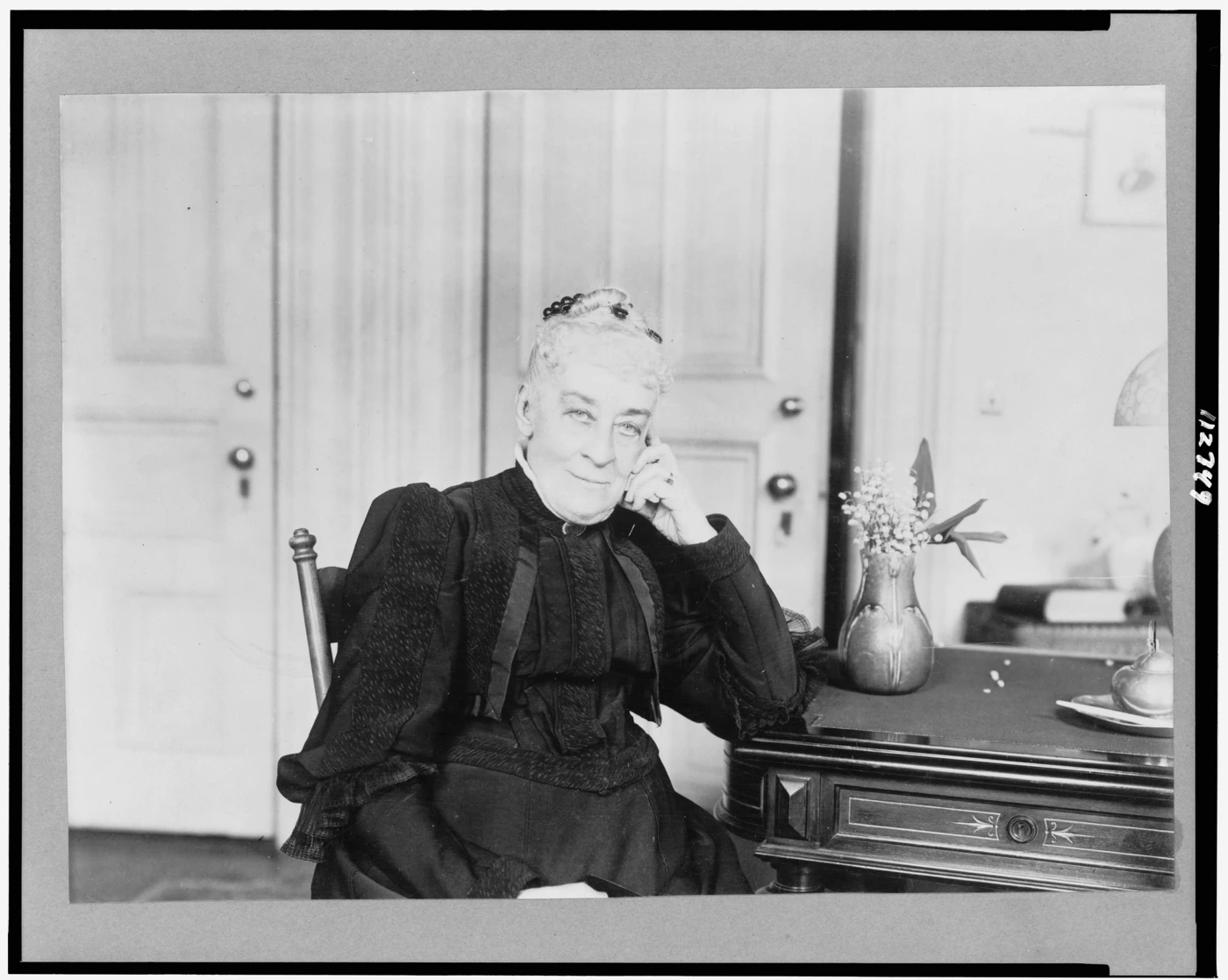 Margaret Olivia Slocum Sage seated for a portrait in 1907.