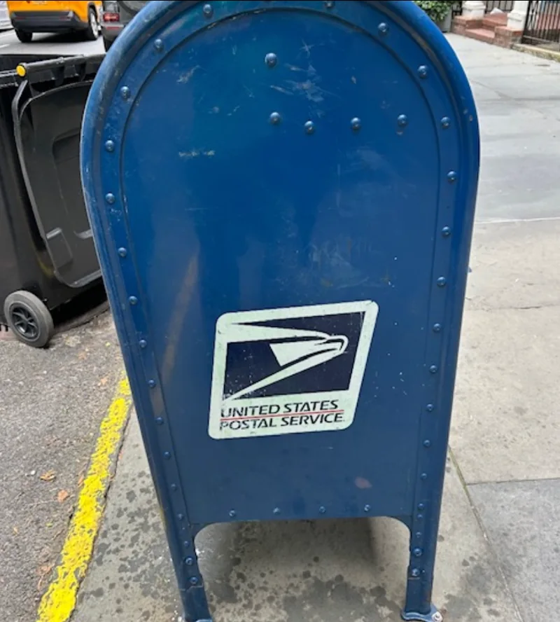 The blue USPS collection box with the graffiti removed.