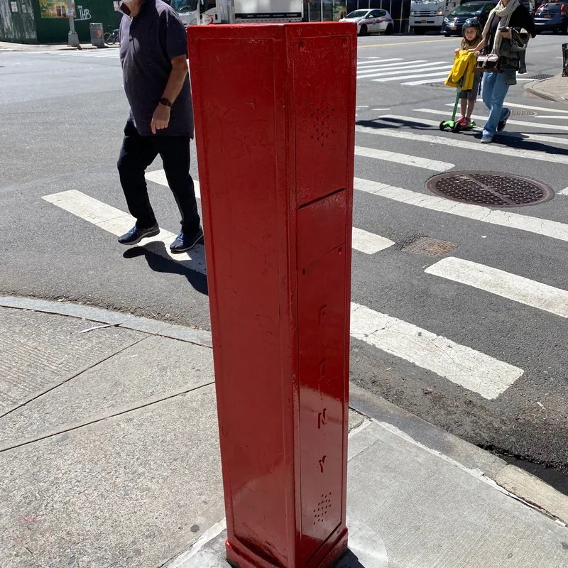 The same street box repainted red.