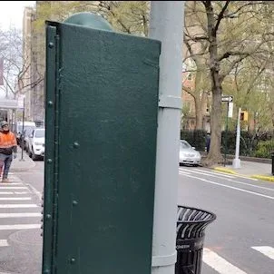The back of the traffic control box repainted green.