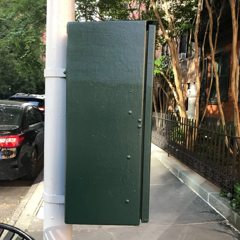 The green traffic control box with the sticker removed.