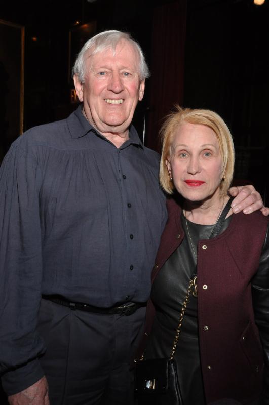 Actor Len Cariou and Arlene Harrison pose together indoors.