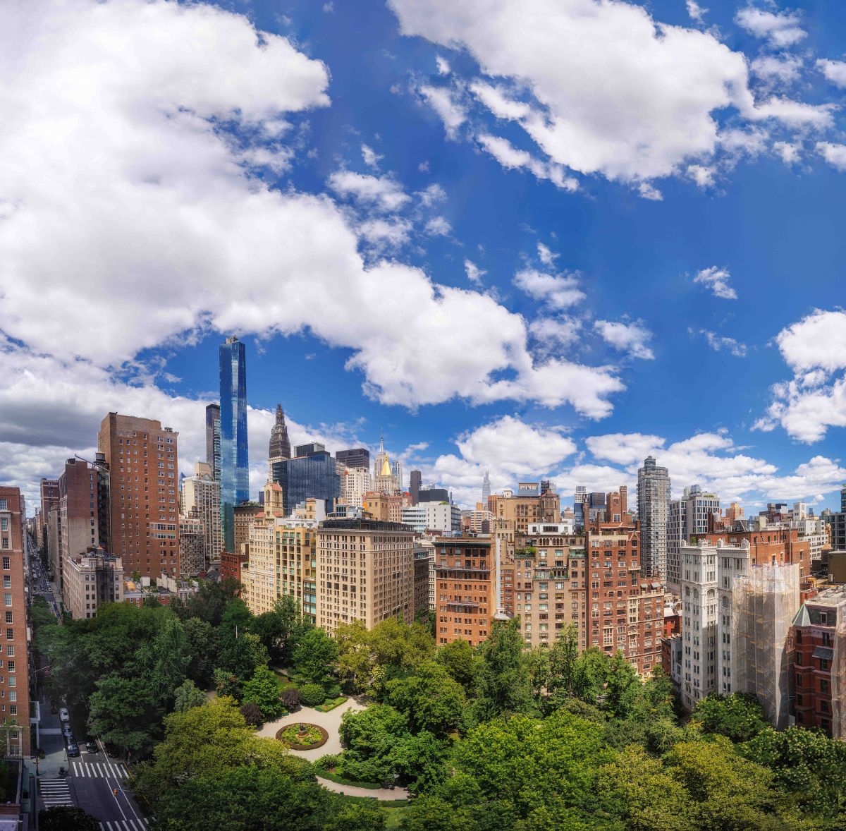 Gramercy Park’s summer canopy and winding gravel paths, surrounded by the buildings bordering the Park.