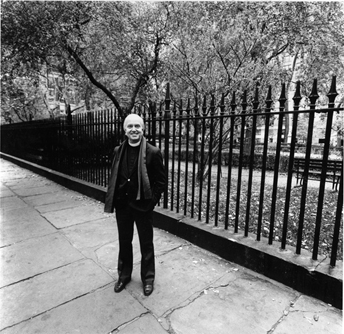 Stephen Garmey stands beside the Park fence.