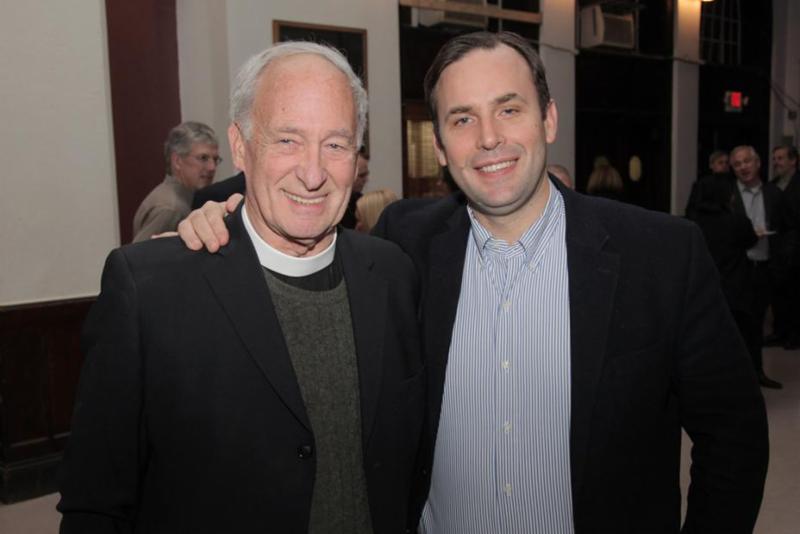 Tom Pike and Jacob Smith stand together at a neighborhood gathering.