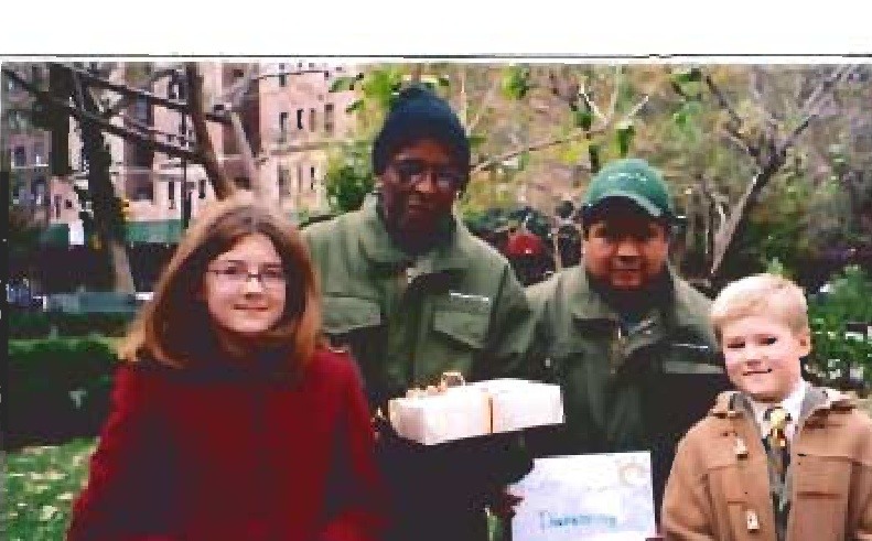 Children and Park caretakers stand together with homemade gifts.