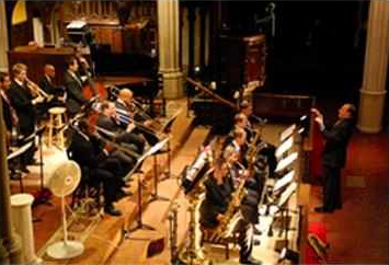 A jazz band performs beneath the arches of Calvary Church.