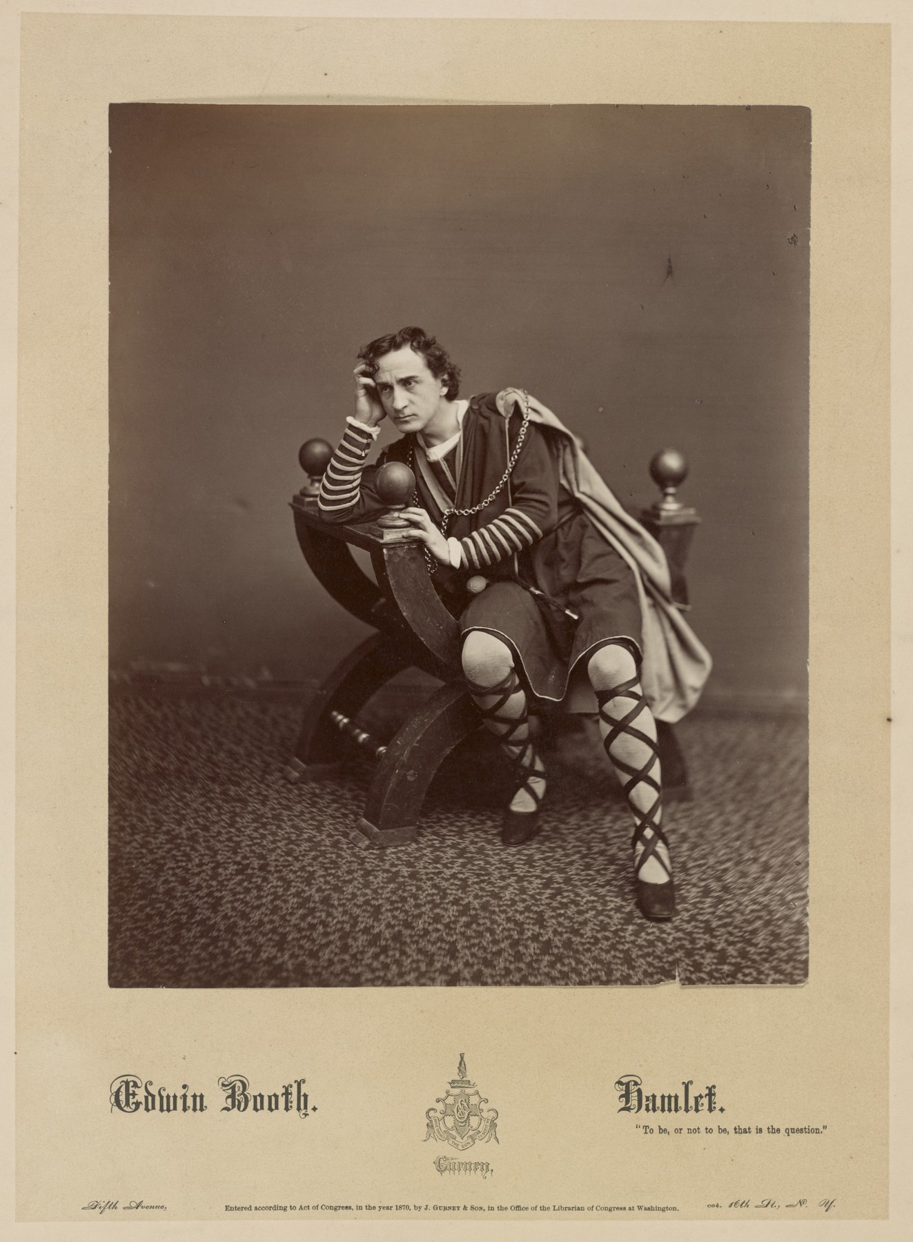 Edwin Booth in costume as Hamlet, leaning on a chair in an 1870 studio photograph by J. Gurney & Son.