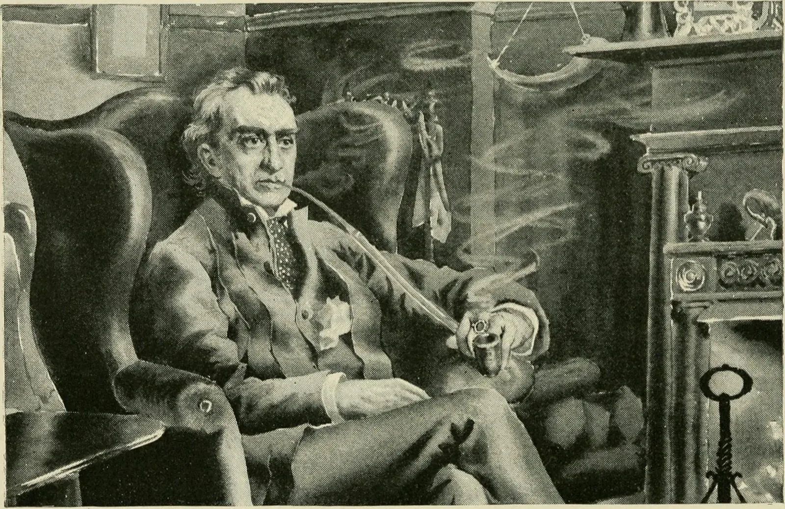 Edwin Booth seated in an armchair beside the fireplace in his room at The Players.