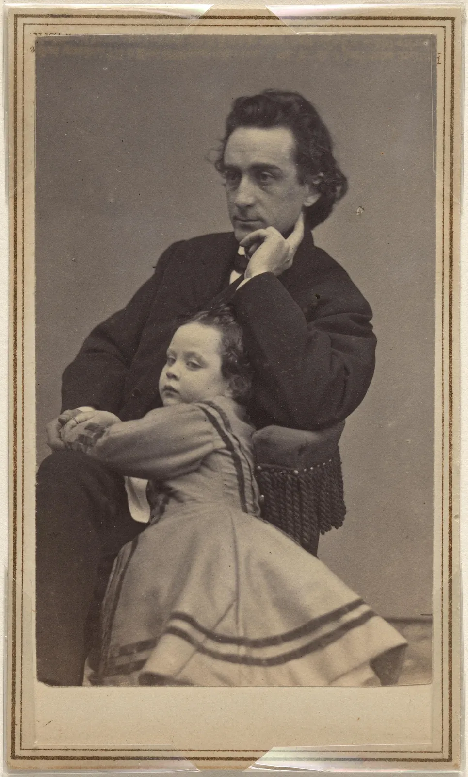 Edwin Booth seated with his young daughter Edwina beside him.