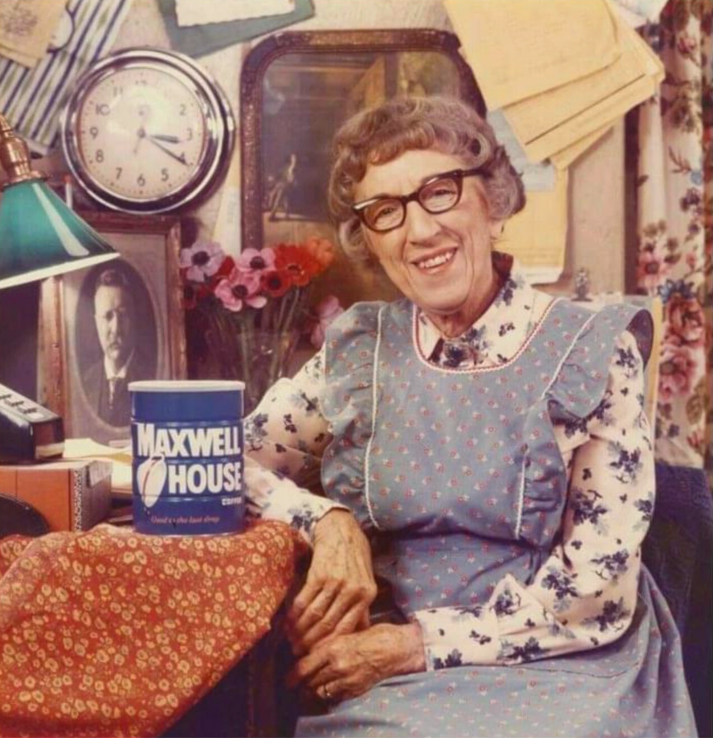 Margaret Hamilton smiling as Cora beside a Maxwell House coffee can.