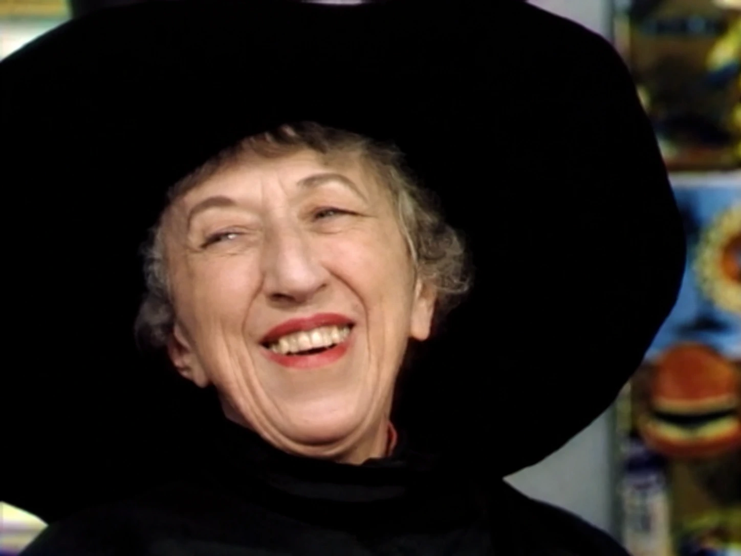 Margaret Hamilton smiling in the Witch’s hat during her 1975 visit to Mister Rogers’ Neighborhood.