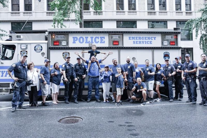 Abigail Arias with family, neighbors and police officers during the 2019 visit.