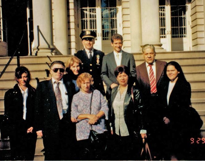 The Sanchez family, Arlene Harrison and police officials outside City Hall after approval of the street naming honoring Anthony Sanchez.