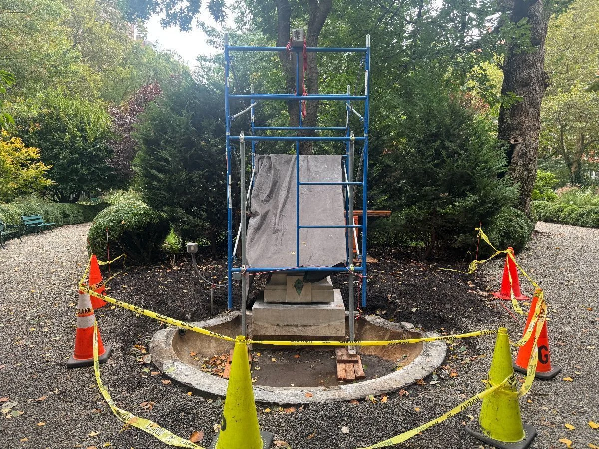 Scaffolding, protective covering and cones surround the Ruggles Fountain during restoration.