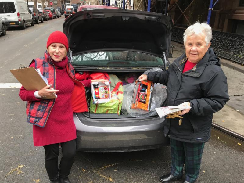 Arlene Harrison and Fox House Director Sister Florence Speth with donated goods for the Block Association’s holiday drive.