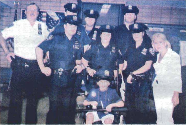 Jonah Gold with police officers and Arlene Harrison.