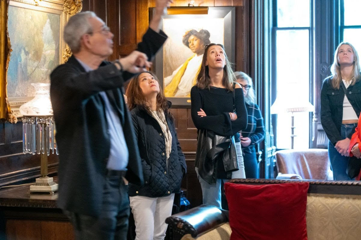 Visitors look at details inside the Tilden Mansion.