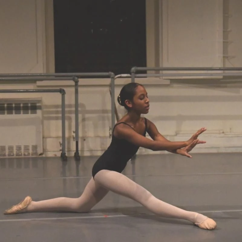 A young dancer at work in the ballet studio.