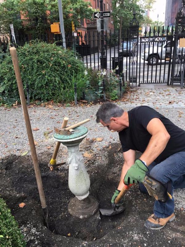 Work at the base of the Gramercy Park sundial during the 2017 restoration project.